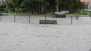 Queensland floodwaters breach Maryborough barricades
