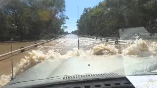 Crossing flooded river and bridge.