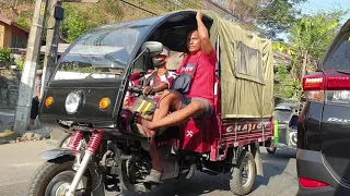 Tricycle rides in the Philippines traffic morning