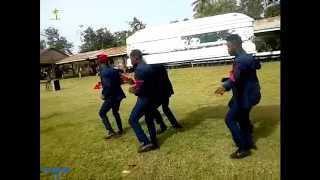 Dead body falls from casket just because of bad dancers