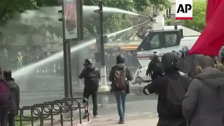 Police using water cannon to disperse Paris protesters