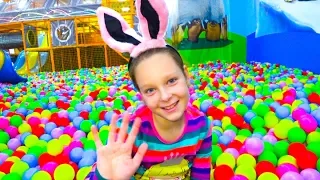 Polina plays at the indoor playground