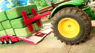 HOW to quickly UNLOAD HAY BALES with TRACTORS on the Corleone Farm