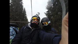 Beginners try to ski down a red slope