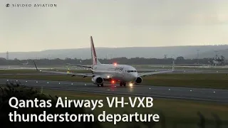 Qantas Airways (VH-VXB) departing Perth Airport during a thunderstorm.