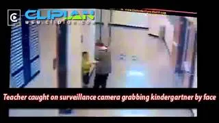 Teacher caught on surveillance camera grabbing kindergartner