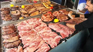 Carnivore Paradise. Giant Grills of Angus Beef, Sausages, Ribs. Street Food @ Biker Fest in Italy