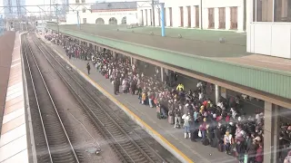 Thousands try to flee Kyiv by train as Russian forces advance