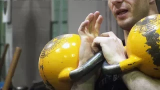 Denis Vasiliev explains how to lock the handles of the kettlebells in the rack position