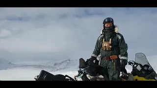 Top of the mountain with snowmobile. Svalbard