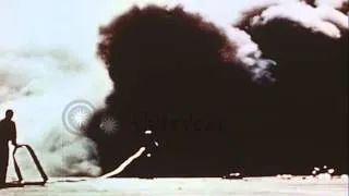 Crew members fight fire on U.S. Aircraft carrier struck by Japanese Kamikaze airp...HD Stock Footage