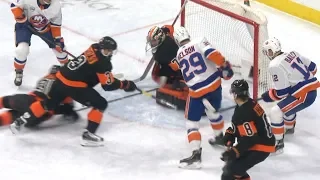 Brock Nelson shows off hand-eye coordination by batting puck past Hart