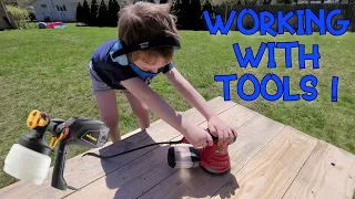 KIDS AND TOOLS - Little worker helps stain a picnic table! Power tools, sander and paint sprayer!