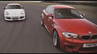 Porsche Cayman R and BMW 1-series M Coupe drifting sideways