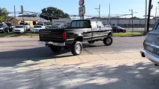 1997 Ford F350 4 x 4, power stroke, 7.3 diesel dream truck pulling out of the shop and driving out