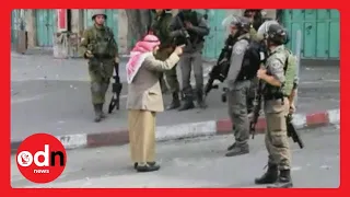 Elderly Palestinian man confronts armed Israeli soldiers before collapsing