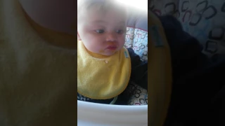 Angry baby eating.