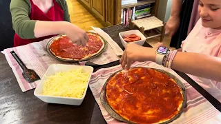 Making Pepperoni Pizza. Love it when kids are in the kitchen!