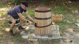 Coopering a 36 gallon beer barrel with hand tools.