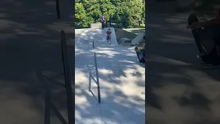 Scootering at a skate park