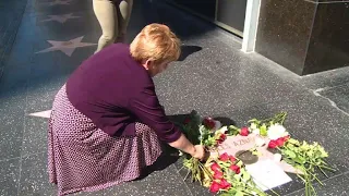Fans lay flowers at Aznavour's Walk of Fame star