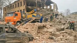 Rescue services on scene after building destroyed in northeastern Ukraine | AFP