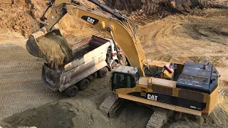 Caterpillar 385C Excavator Loading Trucks