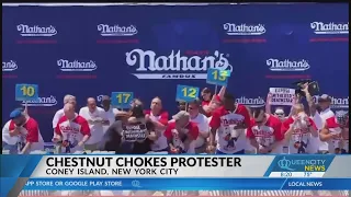 Joey Chestnut puts protester in chokehold en route to July 4 hot dog contest victory