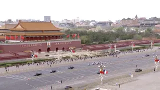 French president Macron's motorcade passes Tiananmen Square