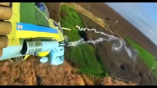 Ukrainian Mi-24 attack helicopters conduct air strikes with rocket fire on the front