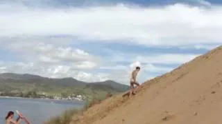 tripping and scrambling up dunes