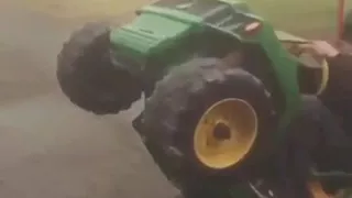 Kid does wheelie on power wheels