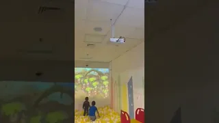 interactive wall projection smash ball games in ball pool for kids playing area.