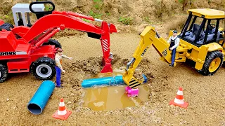 Construction workers repair broken water pipes