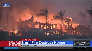 Houses continue to burn in Laguna Niguel as the sun goes down