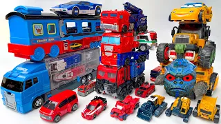 Bigget TRANSFORMERS Car Park: TRANSPORTING Optimus Prime Truck, Train, Bus, Dinosaur JCB Stopmotion