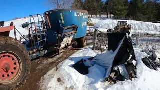 Mixing feed with the TMR feed mixer on a Wisconsin dairy farm