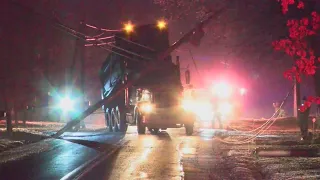 Dump truck gets caught on power lines