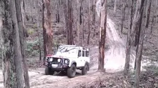 Defender wombat muddy hill climb