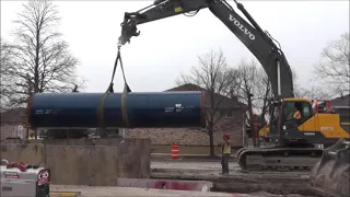 Monster Volvo EC480EL Excavator Lifting and Digging 60 ft. Water Main Line