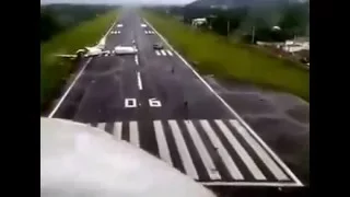 a runway with the crashed aircraft