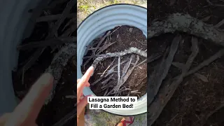 Lasagna method to fill a raised garden bed… cheaper + better than all soil! #shorts