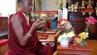 Lama Karma Drodul demonstrates mudras from Medicine Buddha Puja