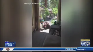Woman orders bear to get off porch