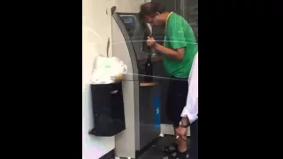 Drunk guy using an atm