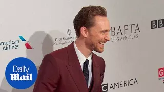 Tom Hiddleston arrives at the 2017 BAFTA Awards Tea Party in red - Daily Mail