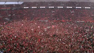 The moment Bayer Leverkusen fans stormed the pitch after winning their first ever Bundesliga