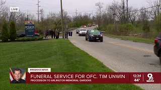 Fallen officer's procession stops at department where he served