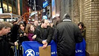 Hugh Jackman signing fan's hand backstage at Back on Broadway