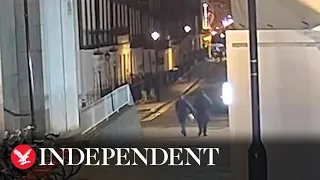 Moment robber suddenly attacks victim for his watch after befriending him in bar